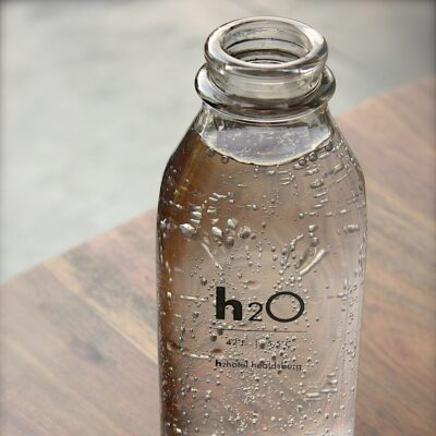 water in a glass bottle for proper hydration